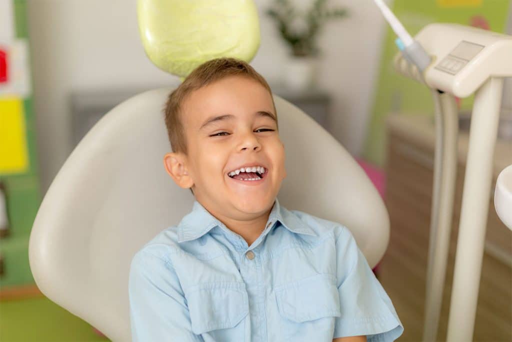 Child in dentist seat image